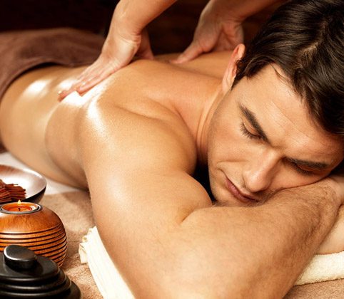 Man receiving body or back massage in spa